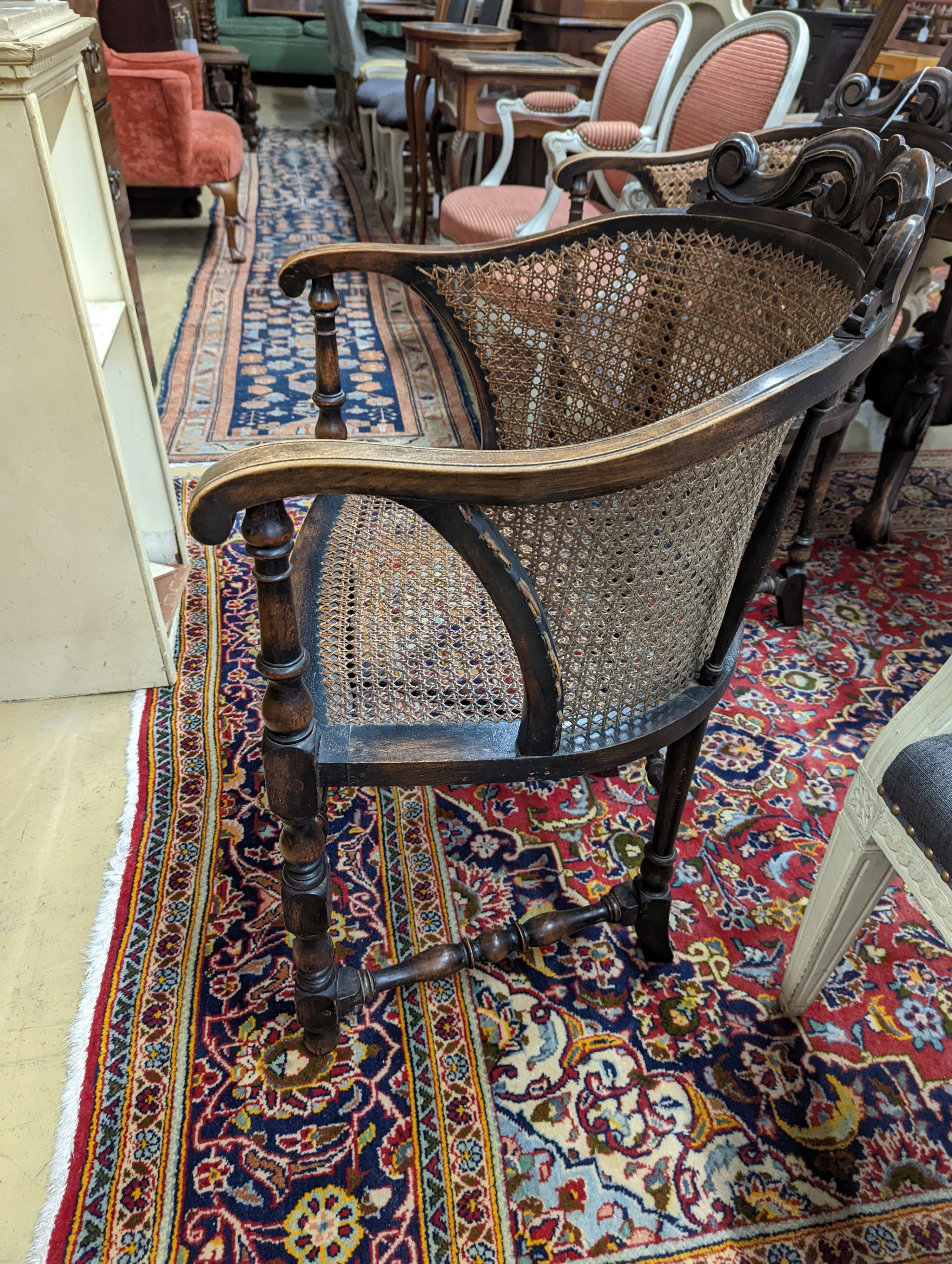 A pair of early 20th century Carolean style caned beech tub framed chairs, width 56cm, depth 48cm, height 85cm